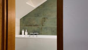 a bathroom with a sink and a mirror at Dom pośrodku Roztocza in Oseredek +12 photos