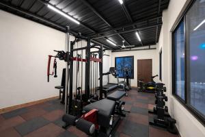 a gym with two tread machines in a room at Riverline Gold Resort in Rishīkesh +47 photos