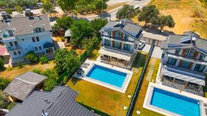 an aerial view of a house with a swimming pool at Cesur Villa in Fethiye