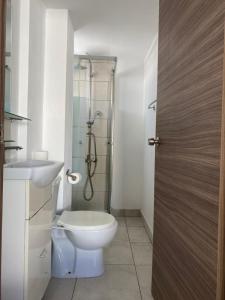 a bathroom with a toilet and a sink and a shower at Midtown Napa Apartments in Ayia Napa +84 photos