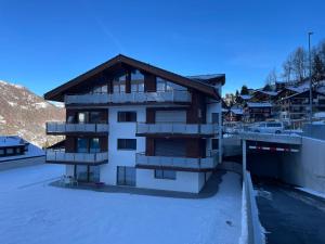 a building with balconies on the side of it at Bergperle in Grächen