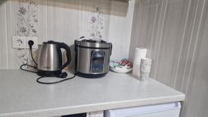a coffeemaker sitting on top of a kitchen counter at Dostoievski 4 in Bălţi +5 photos