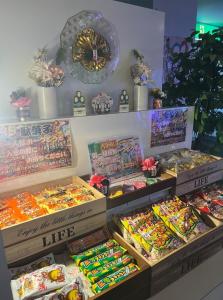 a store with many different types of candy in boxes at ホテル アルファ in Iizaka