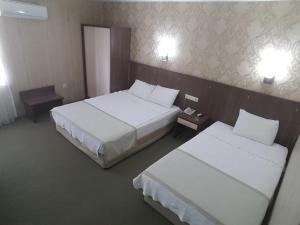 Postel nebo postele na pokoji v ubytování Hosta Otel + 17 fotografií