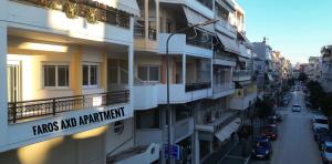 a building with a sign that reads fires and apartment at Faros AXD Apartment in Alexandroupoli