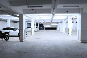 an empty parking garage with cars parked in it at The Premier Comfort in Nairobi