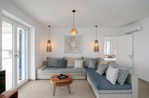 a living room with a couch and a table at Villa Sun in Naxos Chora +55 photos
