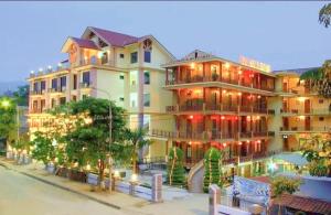 a large building on the side of a street at Sao Mai Bac Ha Hotel in Bắc Hà