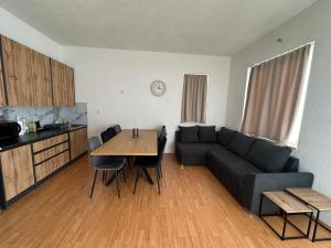 a living room with a couch and a table at Apartman Mandurić in Posušje