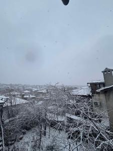 a snow covered city with houses and buildings at dato in Arbanasi