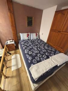 a bedroom with a bed and a dresser at dato in Arbanasi