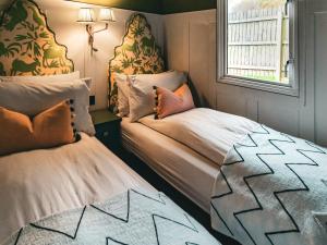 a small room with two beds and a window at The Shepherd - Uk50613 in Sabden