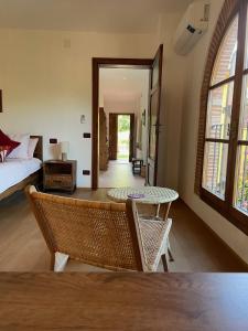 a living room with a bed and a table at La Casa Gialla in Lucca