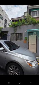 a silver car parked in front of a house at 스타폴스테이 in Seoul