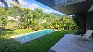a swimming pool in the middle of a yard at Casa Azahares in Yerba Buena