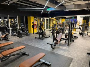 a gym with a bunch of equipment in a room at Splendid view Sinaia in Sinaia