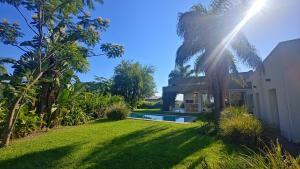 a house with a yard with a swimming pool at Casa Azahares in Yerba Buena