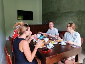 a group of people sitting around a table eating food at Amarante Madiha in Matara