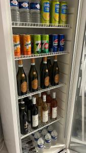 a refrigerator filled with lots of bottles of drinks at Hideaway in Ostrava