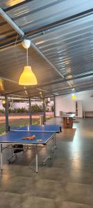 a room with two ping pong tables in it at Flying Fox in Bangalore