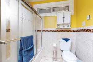 a bathroom with a toilet and a shower at 3 Mi to Franklin Park Zoo! Bright Residential Stay in Boston +16 photos