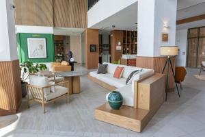 a living room with a couch and a table at Four Points by Sheraton Georgetown in Georgetown