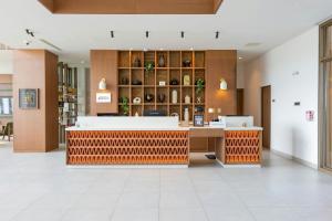 a lobby of a store with a reception counter at Four Points by Sheraton Georgetown in Georgetown