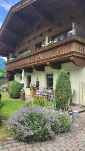 a large building with a balcony on top of it at Appartements Familie Eberharter in Finkenberg