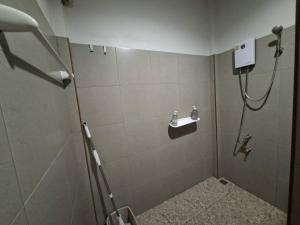 a bathroom with a shower with a sink at Little Blue House- AoNang in Ao Nang  +42 photos