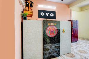aiya sign on a wall in a room at Hotel O Vira Palace in Mumbai