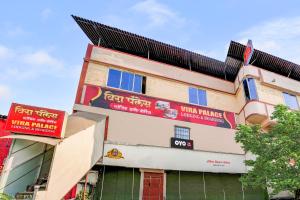 a building with signs on the side of it at Hotel O Vira Palace in Mumbai +22 photos