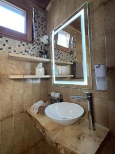 a bathroom with a sink and a mirror at Col Dala Vara in San Cassiano +32 photos