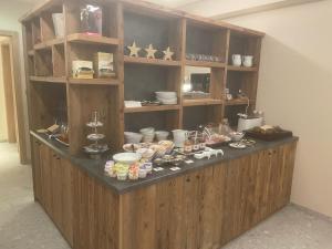 a counter in a room with food on it at Limes Alpine Rooms in Livigno