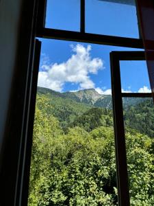 a view from a window of a mountain at Dzveli kokhi in Utsera