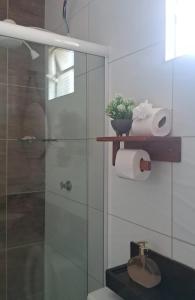 a bathroom with a glass shower and a toilet at POUSADA ALLES in Santo Amaro +17 photos