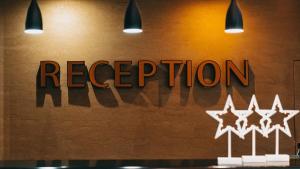 a sign for a restaurant with four stars at Mariam Economy Hotel in Aqaba