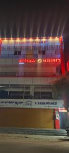 a building with lights on top of it at night at Rk comforts & lodge in Madhugiri +2 photos