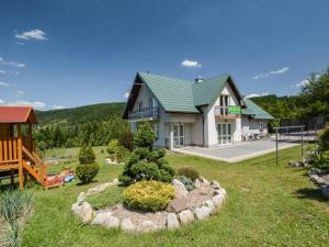 a house with a garden in front of it at Pod Stokiem in Lubomierz