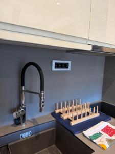 a kitchen counter with a sink and a faucet at Apartments Konaci Centar in Kopaonik +67 photos