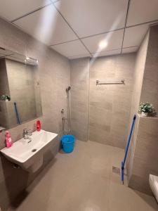 a bathroom with a sink and a shower at Hazelnut -Expo India centre in Greater Noida