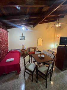 a living room with a couch and a table at Appart Hotel Garay in Rafaela