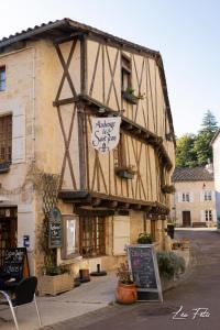 a building with a sign on the side of it at Résidence Campagne Charentaise in Val-de-Bonnieure
