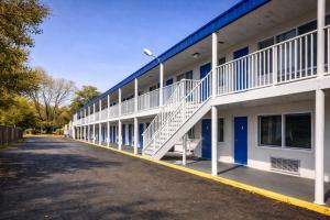 a building with a staircase on the side of it at Capitol Inn by Belvilla Richmond Airport VA in Sandston