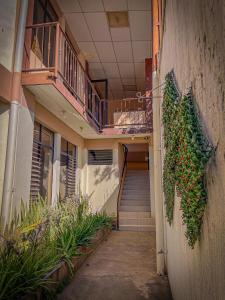 a hallway of a building with stairs and a balcony at Hotel D' Palacio Real in San Miguel