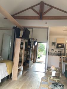 a bedroom with a bed and a large mirror at Guest house arboré in Saint-Loubès +27 photos