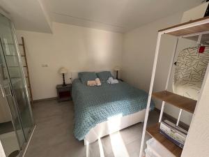 a small bedroom with a bed and a mirror at "Chambre" Chez Zabou in Carpentras