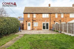a brick house with a large courtyard in front of it at CONEN Morant Place in Grays Thurrock