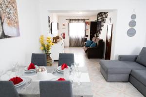 a living room with a table and a couch at Casa 'Saudade' in Moura +23 photos