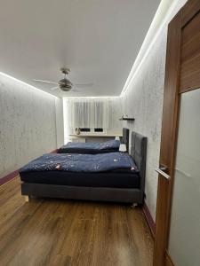 a bedroom with a bed and a ceiling at Apartament Palisadowa 78 in Wałbrzych