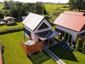 an overhead view of a small house with a roof at Dom z balią in Mikołajki